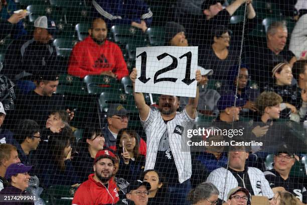Chicago White Sox fans hold up a 121 sign during the sixth inning in the game between the Los Angeles Angels and the Chicago White Sox at Guaranteed...