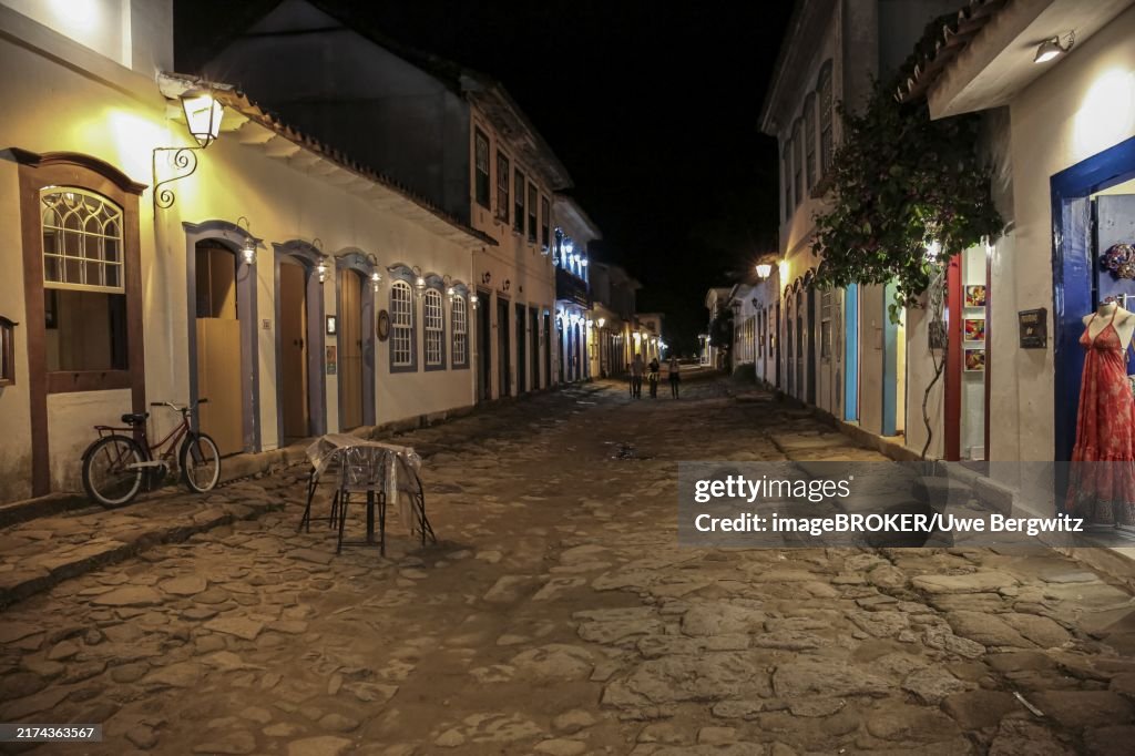 Atmospheric night view of illuminated street and buildings in historical center of Paraty, Brazil, Unesco World Heritage, South America