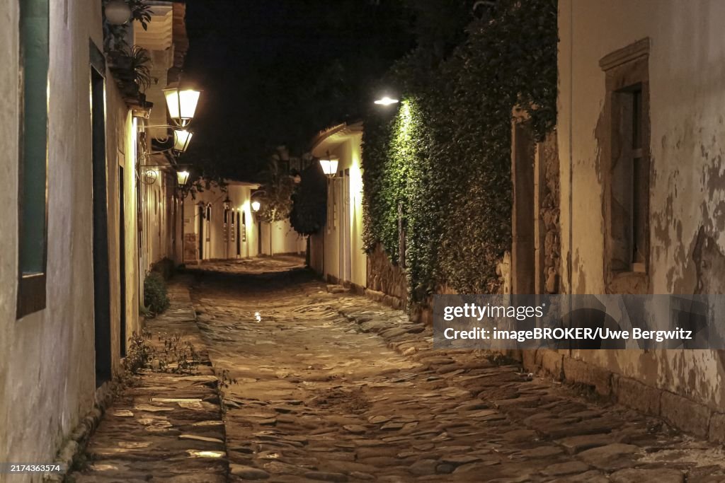 Atmospheric night view of illuminated street and buildings in historical center of Paraty, Brazil, Unesco World Heritage, South America