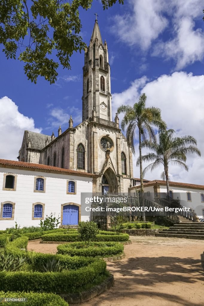 View to church and buildings with blue sky and white clouds, Sanctuary Caraça, Minas Gerais, Brazil, South America