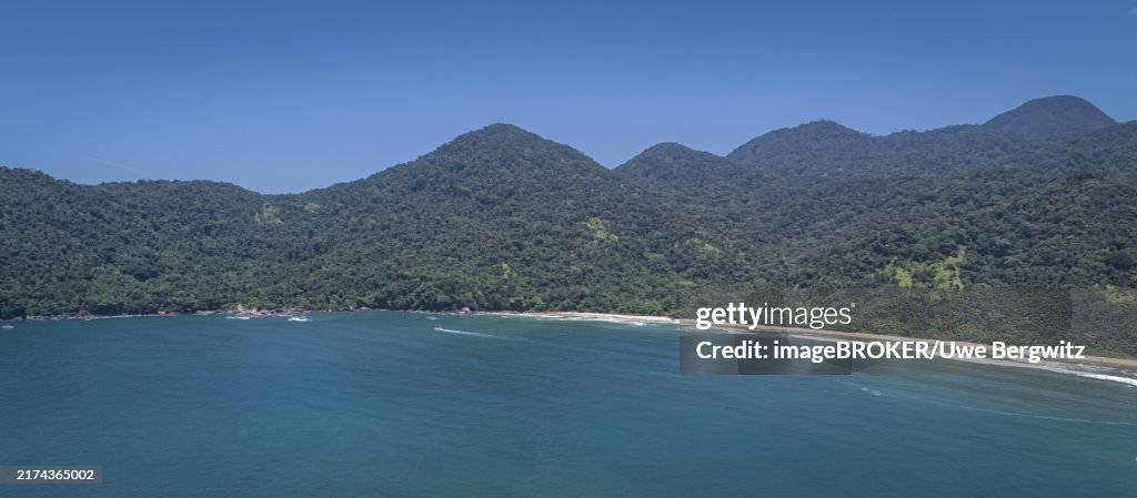 Panoramic aerial view to wonderful Green Coast shoreline and mountains covered with Atlantic Forest, Picinguaba, Brazil, South America