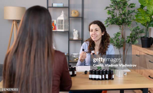 alternative therapy consultation - homeopathic medicine stock pictures, royalty-free photos & images