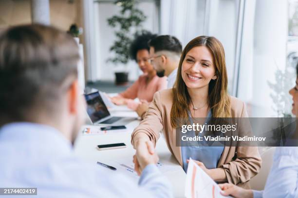 friendly handshake at a business meeting - chief leader stock pictures, royalty-free photos & images