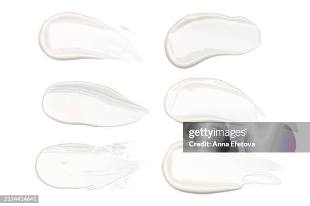 six white textured smears of cosmetic cream with smooth and layered finishes. these samples emphasize the richness and quality of skincare formulations. concept of skincare and beauty. care cosmetics with peptides, prebiotics, ceramides, azelaic acid, ret - nata fotografías e imágenes de stock