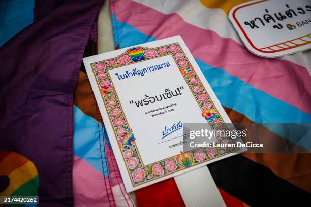 Signs in support of Thailand's marriage equality bill being signed into law on September 25, 2024 in Bangkok, Thailand. King Maha Vajiralongkorn...