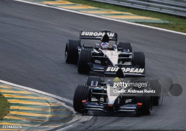Tarso Marques from Brazil drives European Minardi F1 Minardi PS01 European V10 ahead of team mate the Fernando Alonso from Spain driving the European...