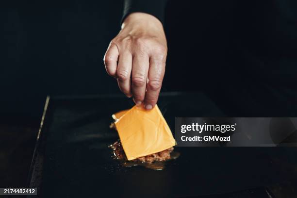 preparing smash burger on bbq grill - plain burger stock pictures, royalty-free photos & images