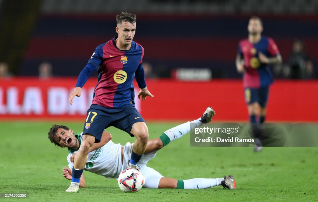 Marc Casado of FC Barcelona runs with the ball after clashing with