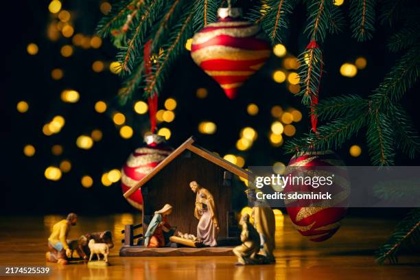 nativity scene under christmas tree - julkrubba bildbanksfoton och bilder