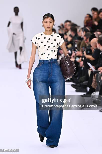 Model walks the runway during the Acne Studios Womenswear Spring-Summer 2025 show as part of Paris Fashion Week on September 25, 2024 in Paris,...
