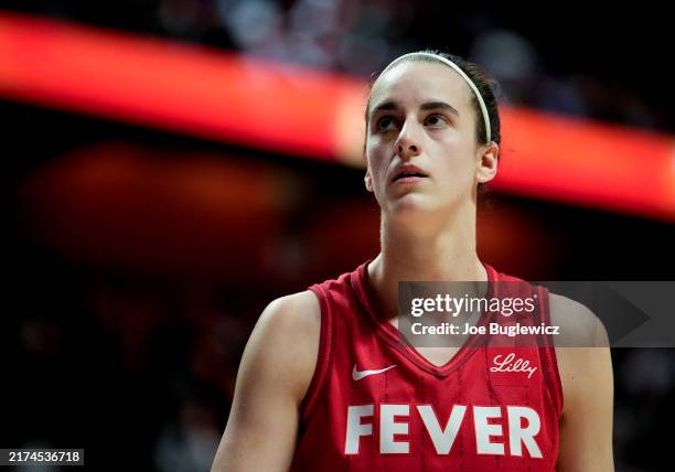 Caitlin Clark of the Indiana Fever looks on as she plays the Connecticut Sun during the first quarter of Game Two of the 2024 WNBA Playoffs first...