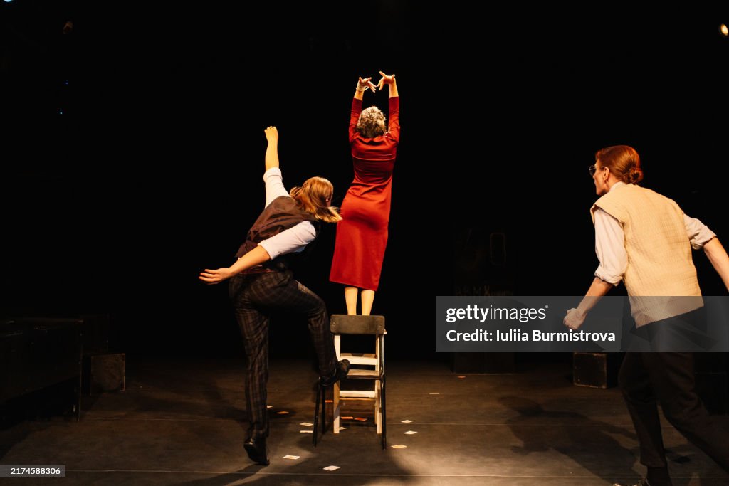 Handsome young theater club members performing in emotional production portraying storyline about infidelity