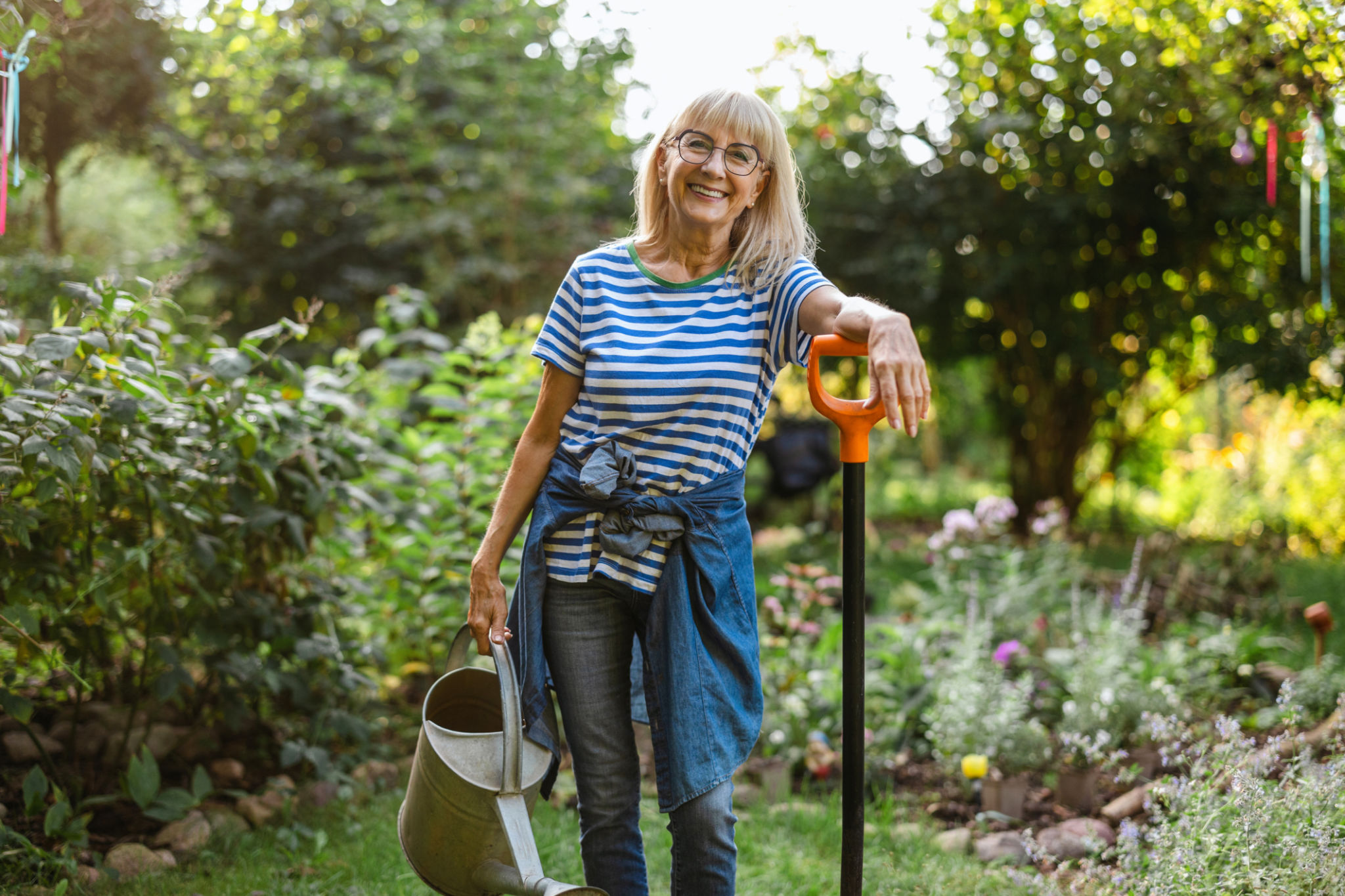 women watering lawn