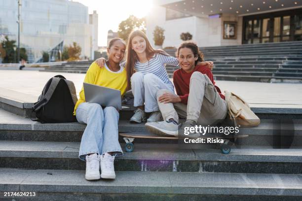 portrait of a happy teenagers outdoors - red laptop bag stock pictures, royalty-free photos & images