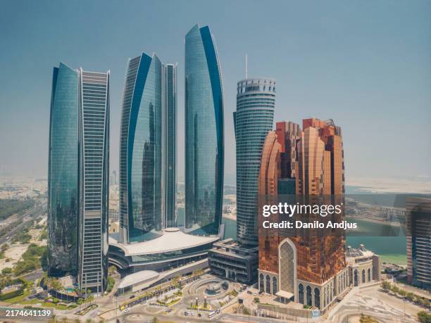 the iconic skyline of abu dhabi - abu dhabi stock pictures, royalty-free photos & images
