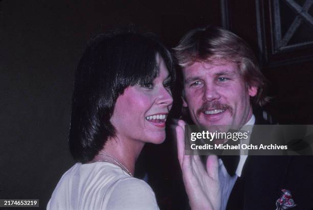 American actress Kate Jackson, wearing a white outfit, and American actor Nick Nolte, who wears a tuxedo and bow tie, attend the 29th Primetime Emmy...
