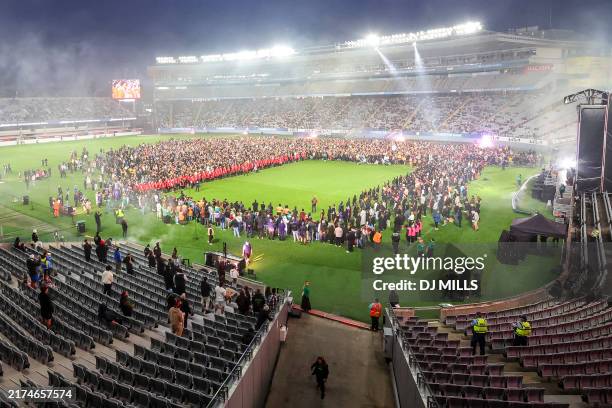 Participants gather in a world record attempt for the largest mass Haka at Eden Park in Auckland on September 29, 2024. The gathering on September 29...