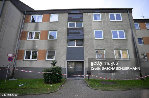 Police cordon is seen in front of an apartment building in Essen, western Germany, on September 29 the day after a fire broke out at the building. A...