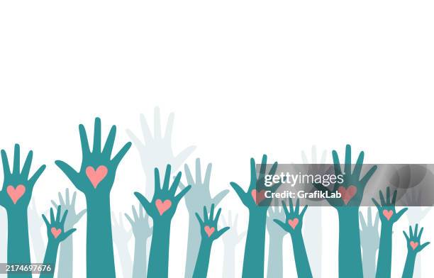 raised hands with hearts symbolizing unity and love - encouragement illustration stock illustrations