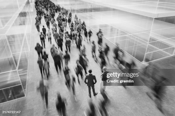 business couple talking in the crowds of people - escala de cinzentos imagens e fotografias de stock
