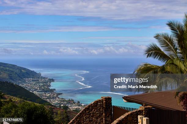 high view from the hillsiide suburb of puna'auia of tahiti's west coast - tahiti stock pictures, royalty-free photos & images