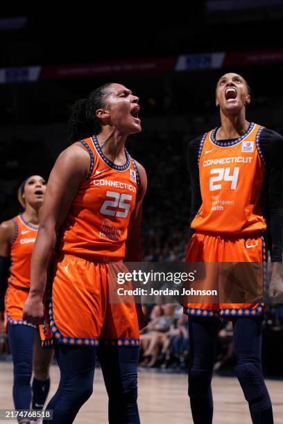 Alyssa Thomas and DeWanna Bonner of the Connecticut Sun celebrates during the game against the Minnesota Lynx during Round Two Game One of the 2024...