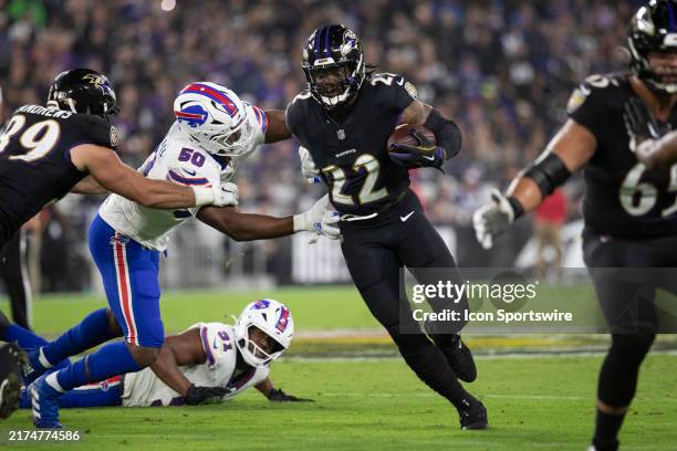 Baltimore Ravens running back Derrick Henry finds a running lane while breaking tackles during an NFL game between the Buffalo Bills and the...