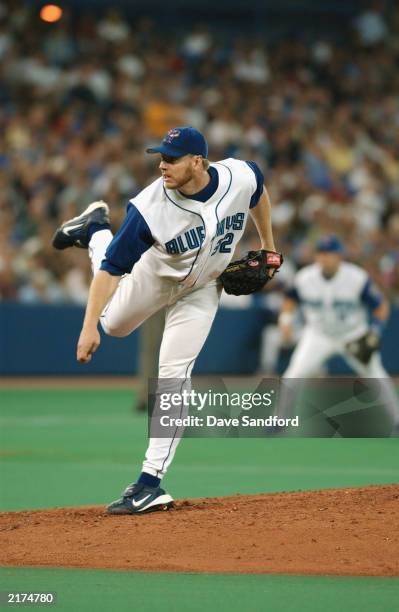 Pitcher Roy Halladay of the Toronto Blue Jays delivers a pitch during the American League game against the New York Yankees at SkyDome on July 12,...