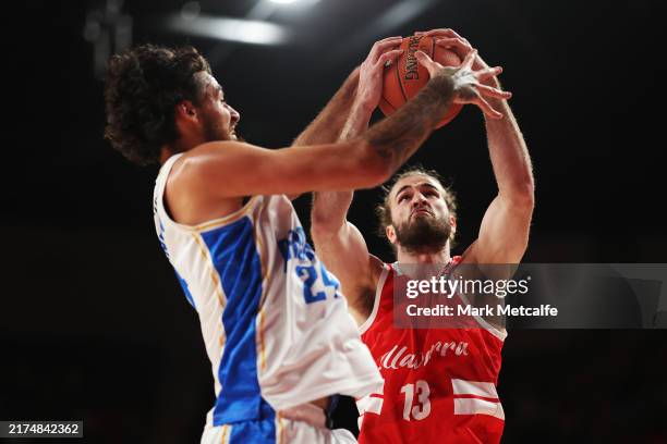 Sam Froling of the Hawks and Tyrell Harrison of the Bullets compete for a rebound during the round two NBL match between Illawarra Hawks and Brisbane...