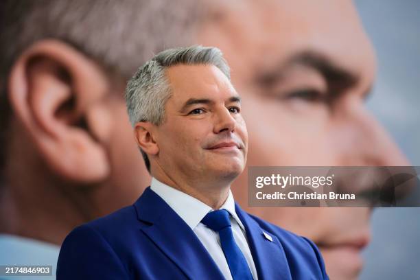 Austrian Chancellor and member of the Austria People's Party Karl Nehammer speaks to the media ahead of Austrian parliamentary elections on September...
