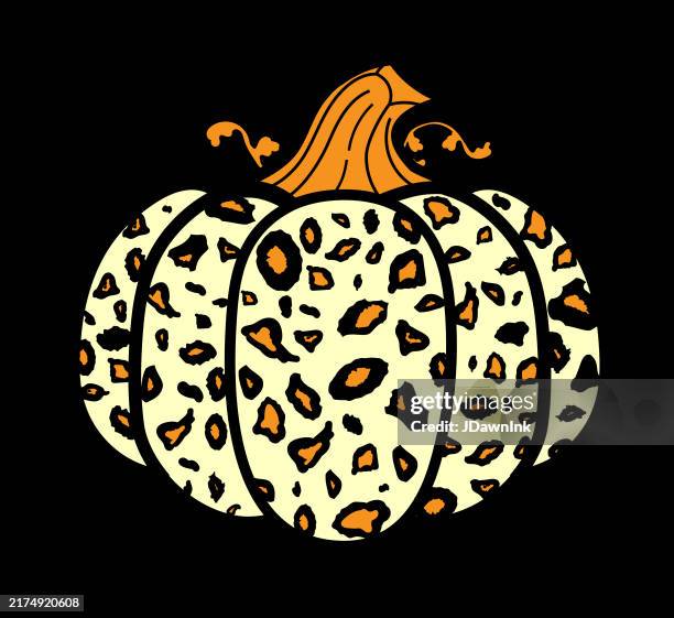 halloween stack of spooky orange pumpkin with leopard print texture on black background - leopard pattern stock illustrations