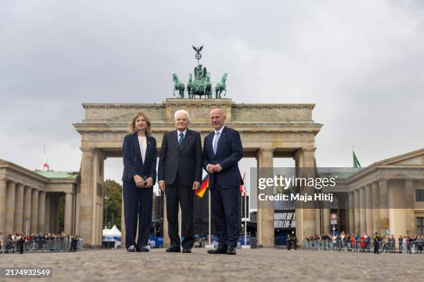 Italy's President Sergio Mattarella poses for a photo with Mayor of Berlin Kai Wegner and Italian First Lady Laura Mattarella in front of the...
