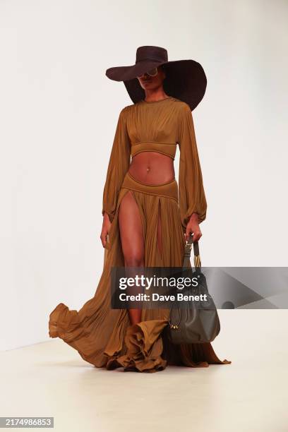 Model walks the runway at the Zimmermann show during Paris Fashion Week Womenswear Spring/Summer 2025 at Palais De Tokyo on September 30, 2024 in...