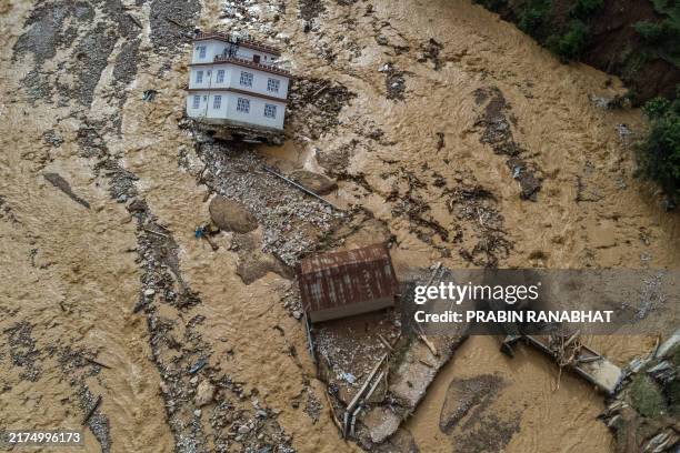 Floding Disastes TOPSHOT - An aerial view shows the area affected by monsoon flooding ...