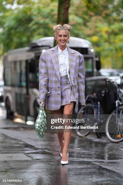 Emily Sindlev white buttoned up long sleeve shirt, dark brown dark purple plaid pattern/print mini skirt, dark brown dark purple plaid pattern/print...