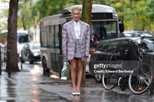 Emily Sindlev white buttoned up long sleeve shirt, dark brown dark purple plaid pattern/print mini skirt, dark brown dark purple plaid pattern/print...