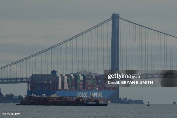 Container ship moves past the Verrazano Bridge as seen from New Jersey as East Coast Ports may shut down due to a potential dockworker strike in New...