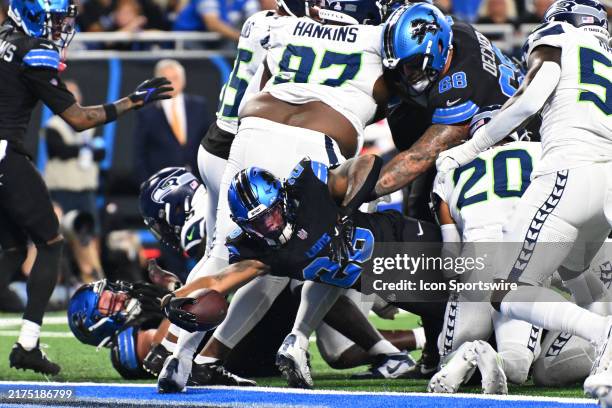 Detroit Lions running back Jahmyr Gibbs reaches the ball across the goal line during the Detroit Lions versus the Seattle Seahawks game on Monday...