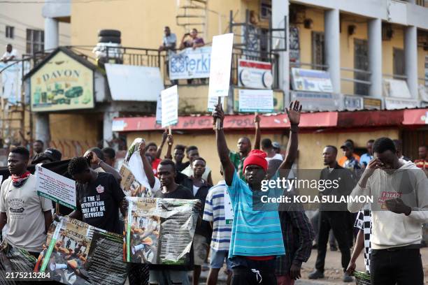 Protesters carry placards during the "Fearless In October" protest over bad governance in Abuja, Nigeria on October 1, 2024.