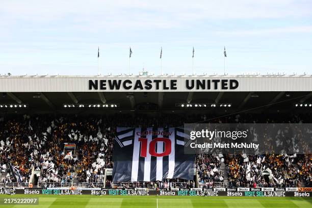 General view inside the stadium as fans hold a flag featuring the shirt of Anthony Gordon of Newcastle United prior to the Premier League match...