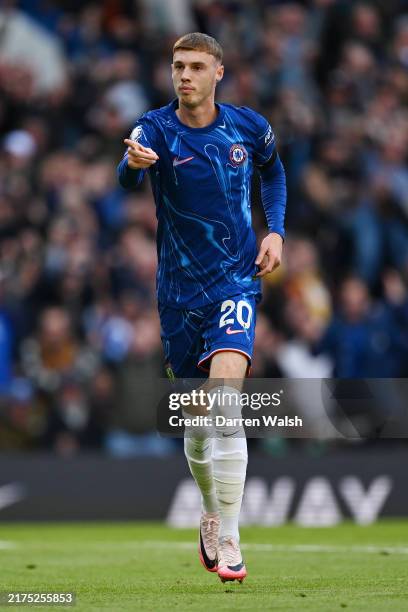 Cole Palmer of Chelsea celebrates scoring his team's first goal during the Premier League match between Chelsea FC and Brighton & Hove Albion FC at...