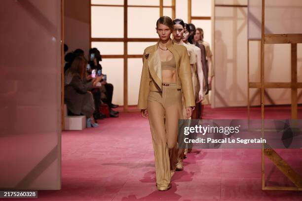 Models walk the runway during the Hermès Paris Womenswear Spring-Summer 2025 show as part of Paris Fashion Week on September 28, 2024 in Paris,...