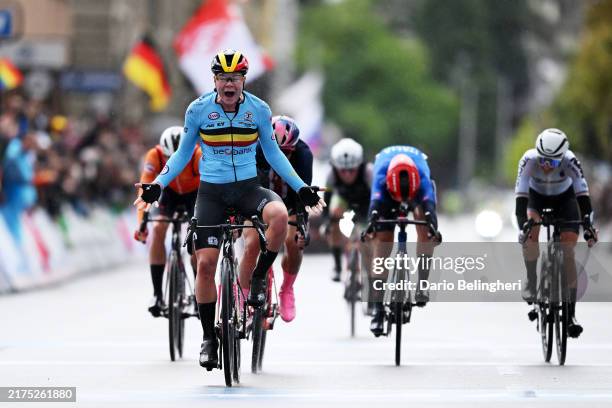 Lotte Kopecky of Team Belgium celebrates at finish line as gold medal winner ahead of Chloe Dygert of Team United States, Elisa Longo Borghini of...