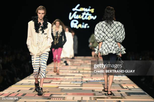 British model Libby Bennett presents a creation by Louis Vuitton for the Women Ready-to-wear Spring-Summer 2025 collection as part of the Paris...