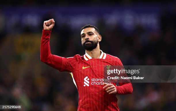 Mohamed Salah of Liverpool celebrates scoring his team's second goal during the Premier League match between Wolverhampton Wanderers FC and Liverpool...