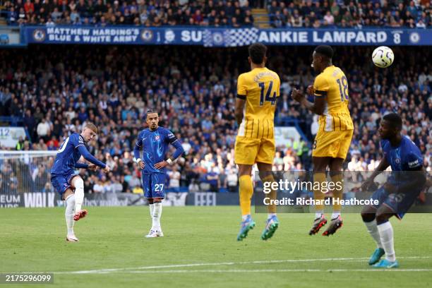Cole Palmer of Chelsea scores his, and his teams, third goal from a free kick during the Premier League match between Chelsea FC and Brighton & Hove...