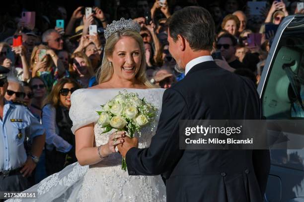 Theodora of Greece arrives on the arm of her brother Paul to marry Matthew Kumar at the Metropolis Greek Orthodox Cathedral on September 28, 2024 in...