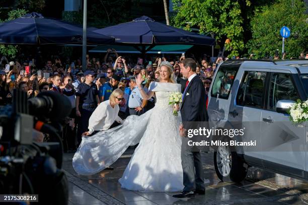 Theodora of Greece arrives on the arm of her brother Paul to marry Matthew Kumar at the Metropolis Greek Orthodox Cathedral on September 28, 2024 in...