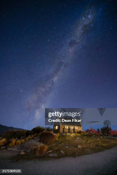 small lakeside church under the milky way - lake tekapo stock pictures, royalty-free photos & images