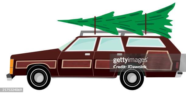 retro station wagon with wood panels carrying a christmas tree for christmas and holiday on white background - station wagon stock illustrations